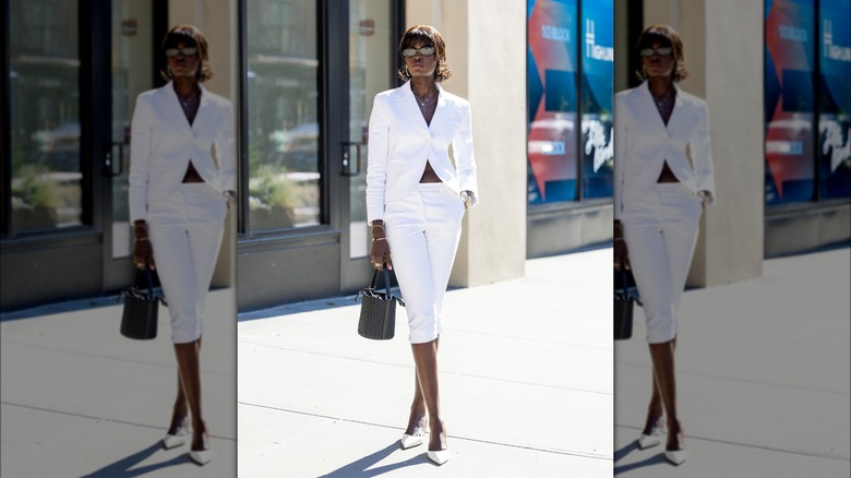 woman in a white capri pantsuit