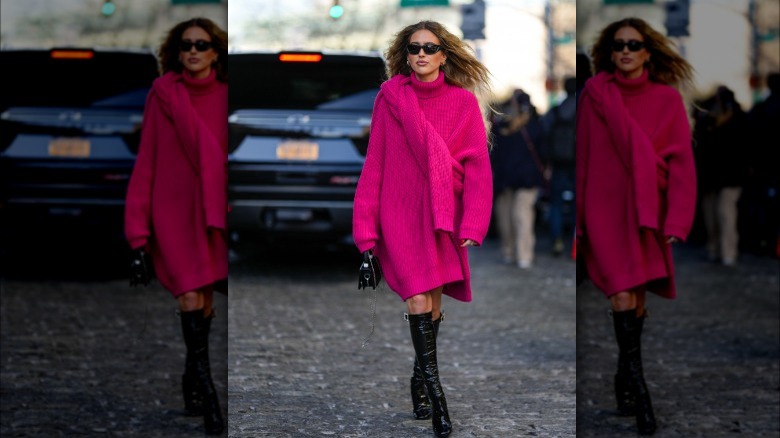 Woman wearing oversized pink sweater dress