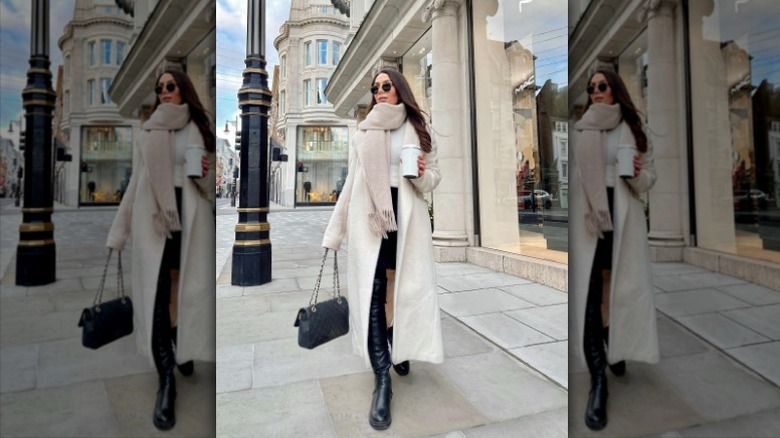 woman wearing white coat with oversized scarf