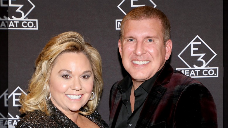 Todd and Julie Chrisley smiling on the red carpet