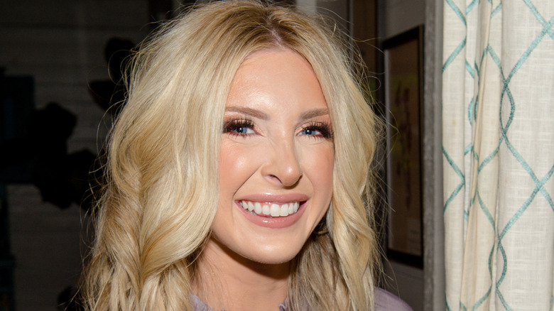 Lindsie Chrisley smiling with red eyeliner