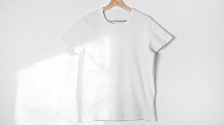 White shirt against white wall