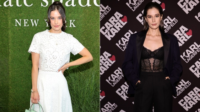 Ella Bleu Travolta poses on the red carpet during fashion week in a white dress and in a black lace bustier with a suit jacket, both in 2022