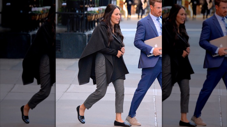 Joanna Gaines walking while wearing a shawl