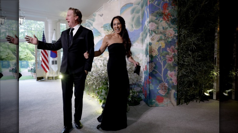 Joanna Gaines smiling in a black sleeveless gown