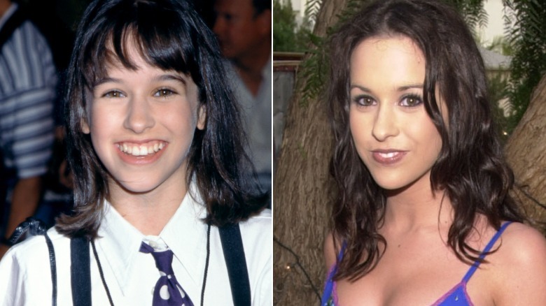 Lacey Chabert smiling in a shirt and tie, next to  her smiling with a purple singlet dress on