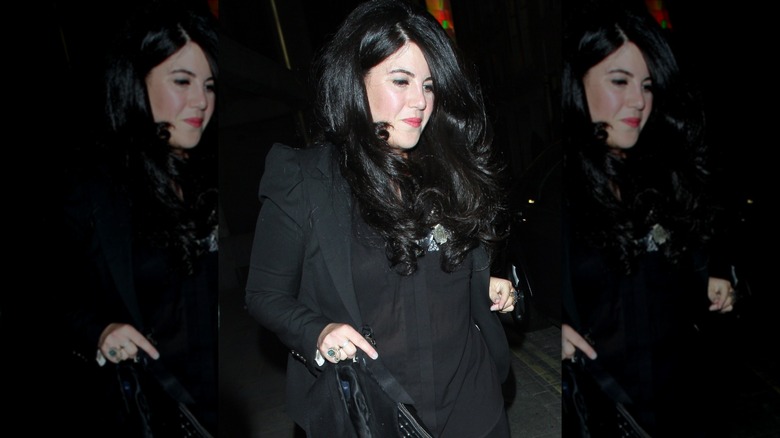 Monica Lewinsky in 2013 walking in a black outfit