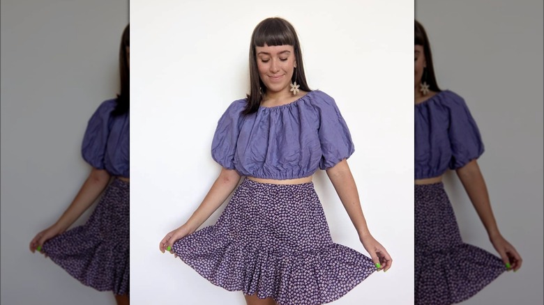 Woman in purple cupcake skirt