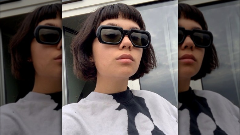 A woman with a short bob haircut