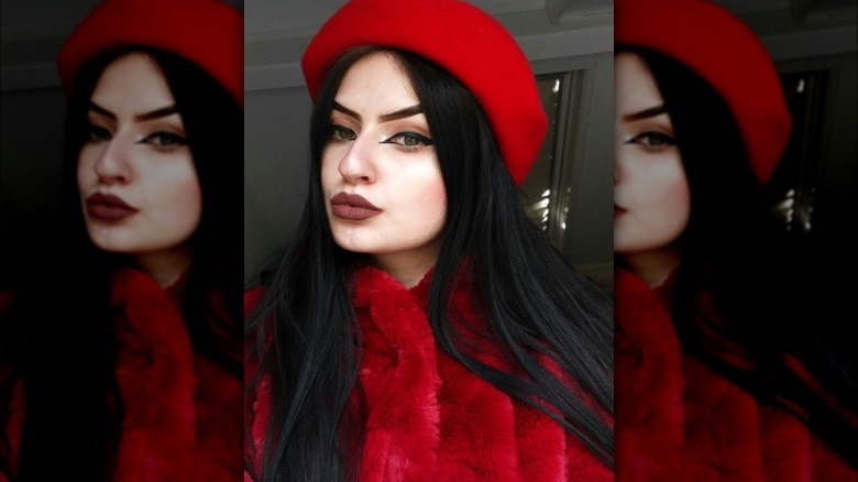 A woman wearing a red outfit