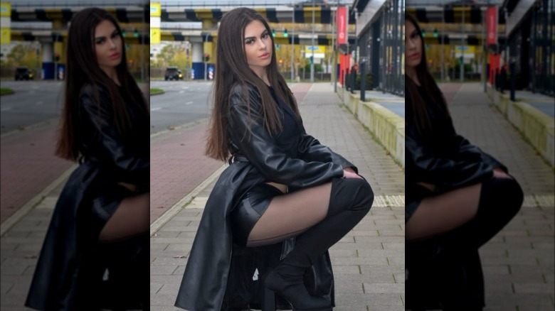 A woman wearing over-the-knee boots