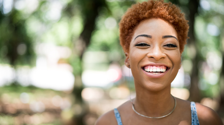 Redheaded woman with pale pink lipstick