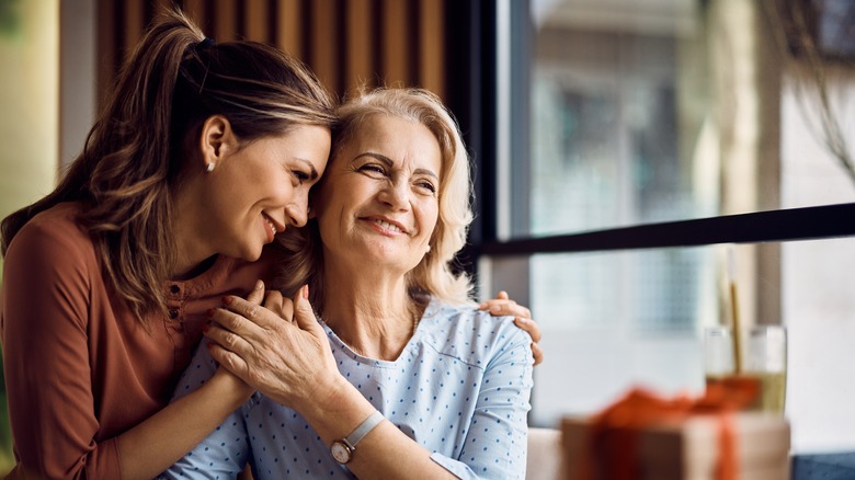 Mother and daughter hugging 