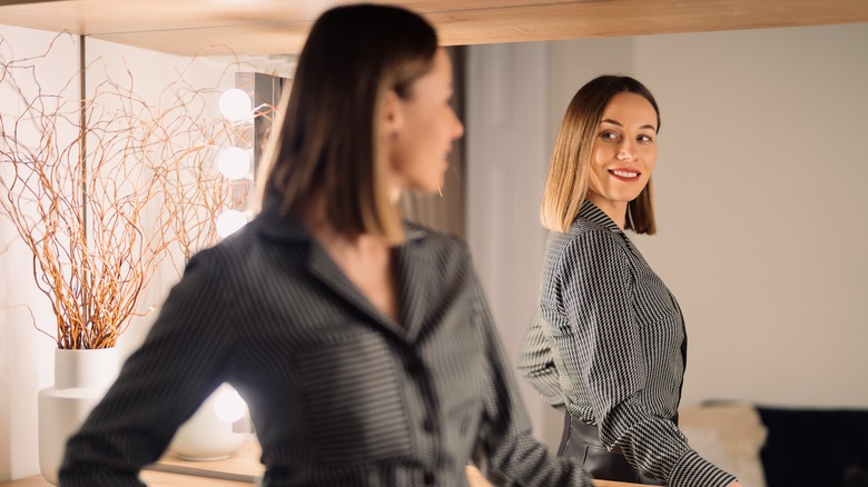Woman looking in the mirror 