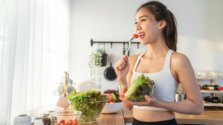woman eating salad