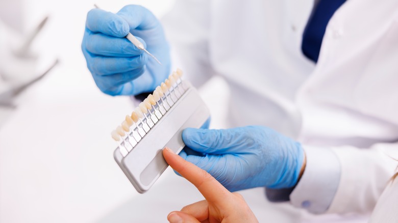 Person picking veneers