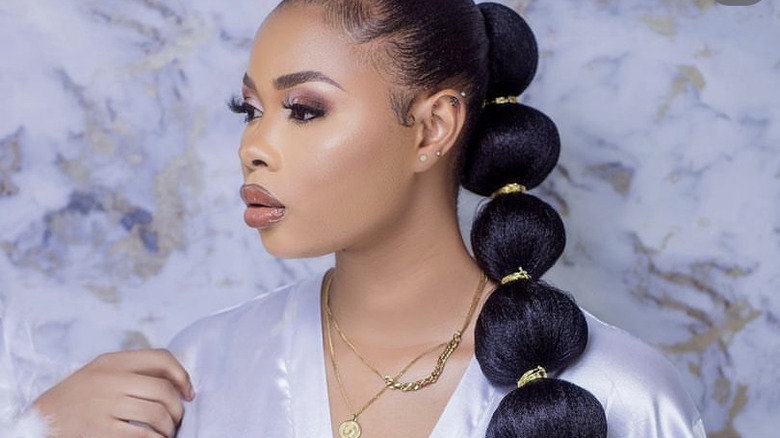 Profile of woman with bubble braids