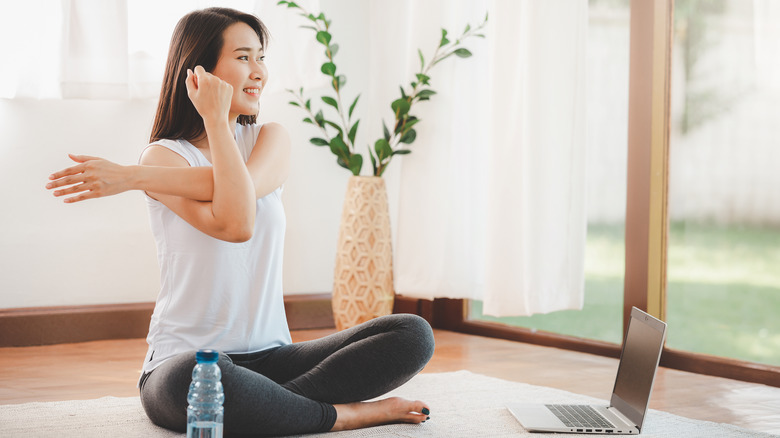 Model stretching on mat at home