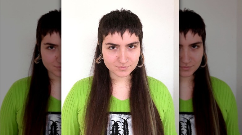 Woman models mullet with choppy bangs 