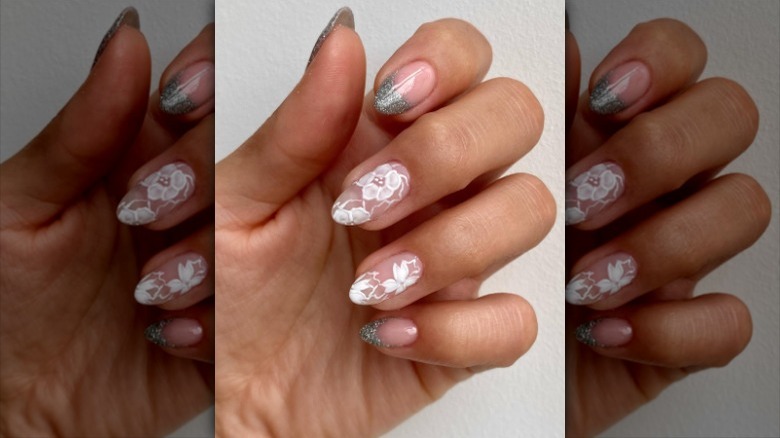 close up of manicure with two lace nails