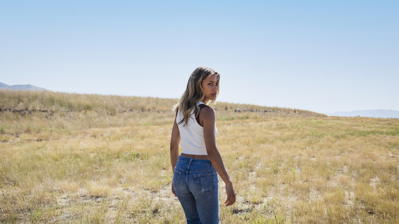 Girl wearing jeans and white tee