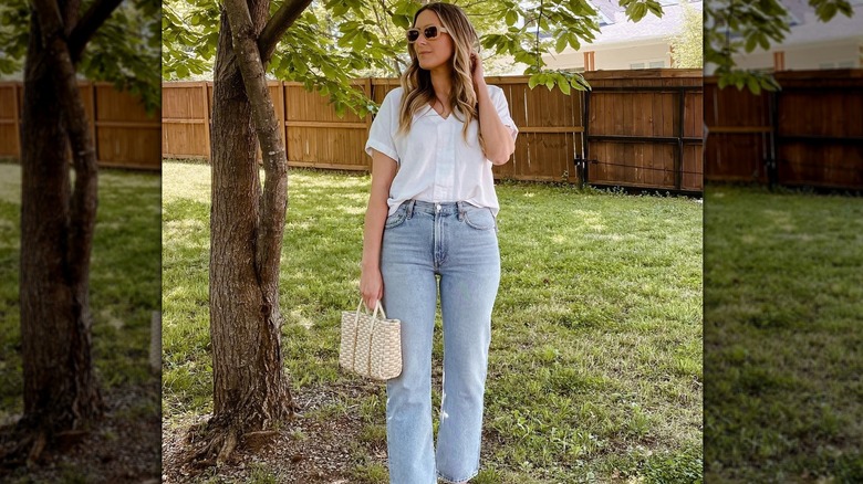 woman in front of fence