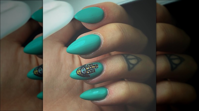 hamsa on turuoise nails
