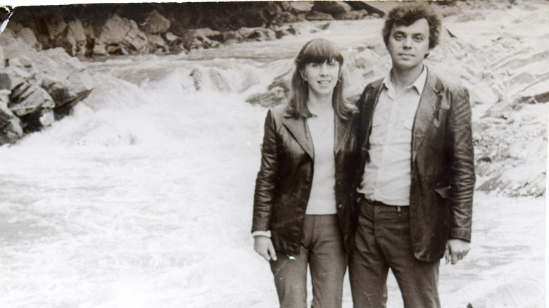 A couple in 1980s style clothing