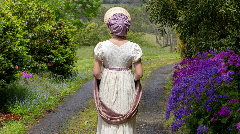 A woman in Regency period style