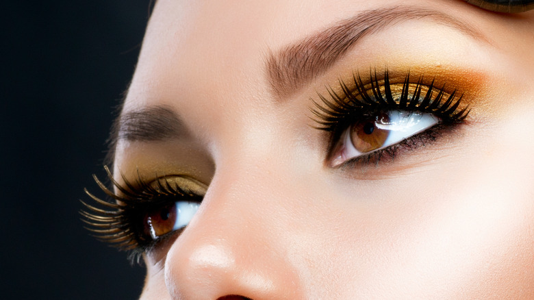 Golden eyeshadow on brown eyes