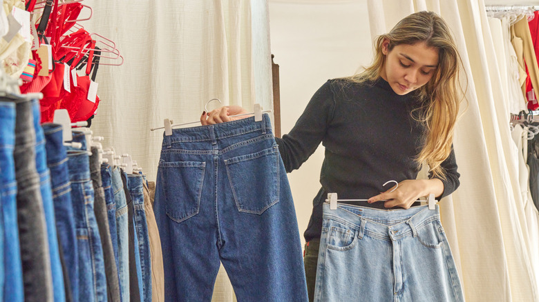 A woman shopping for jeans