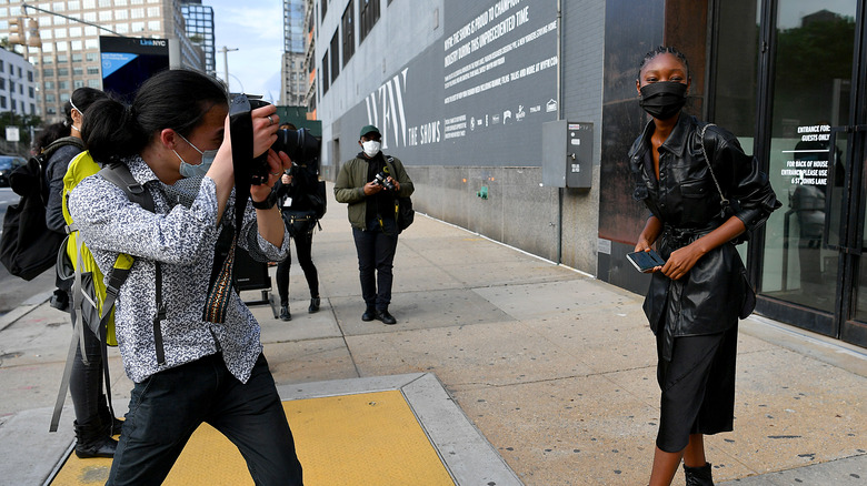 Woman in a mask posing for the camera