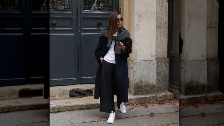 woman wearing black oversized coat and neutral outfit