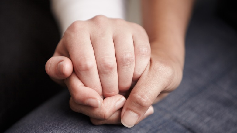 two people holding hands