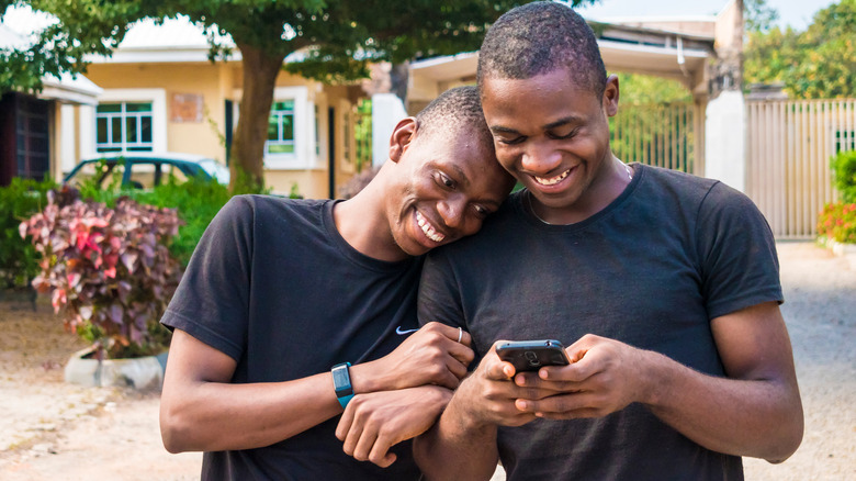 man resting on partners shoulder