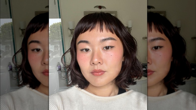 Woman with flippy bob and bangs