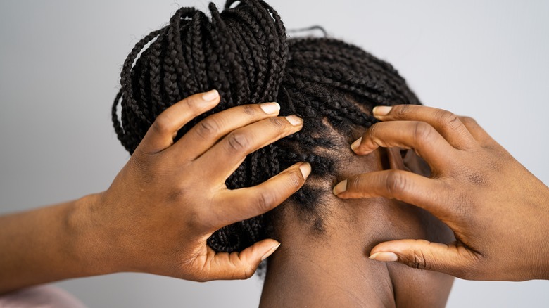 Woman looking at her hair growth