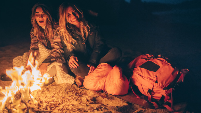 women having bonfire