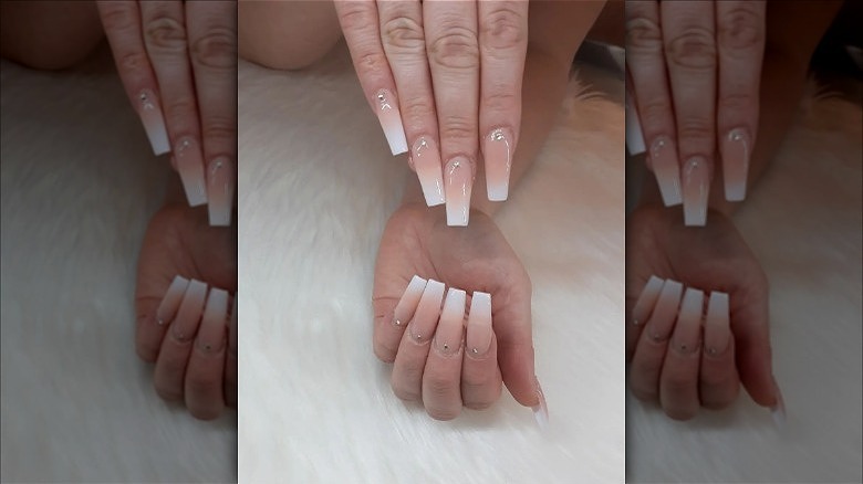 hands with white to nude french fade nails