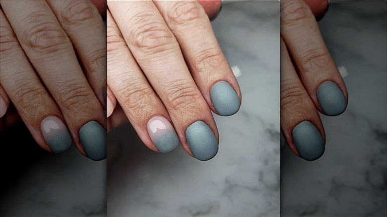 hand with single french fade nail