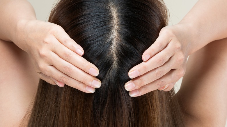 Person rubbing their head