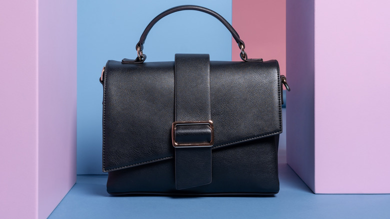 A black rectangular leather handbag