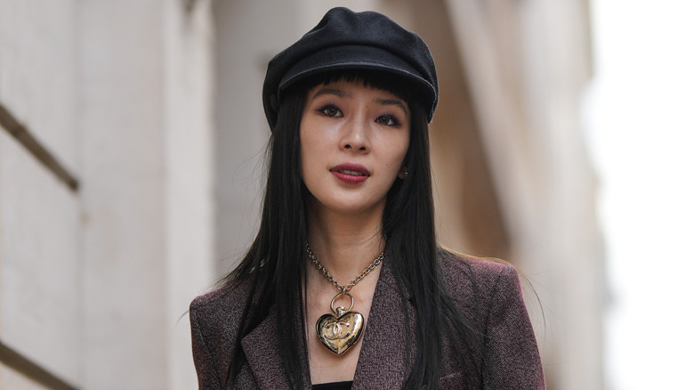 model wearing newsboy hat