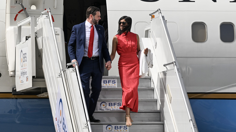 Usha Vance stepping off a plane in a red dress