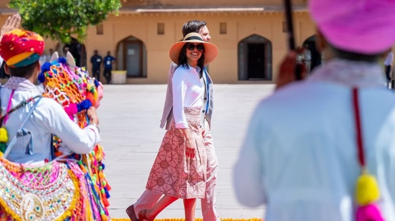 Usha Vance wearing a white shirt and patterned skirt during a parade in India