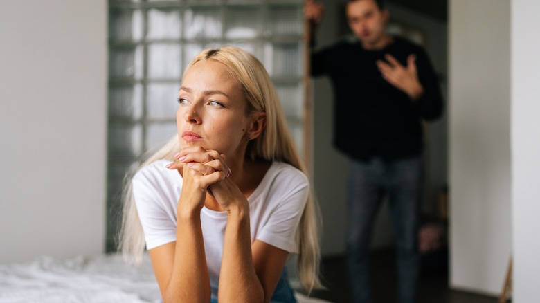unhappy couple in bedroom