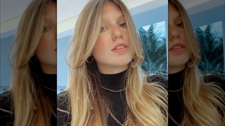 Longer wispy bangs and hush cut