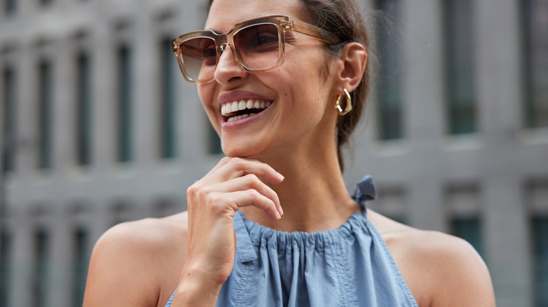 Woman with bronzer on shoulders