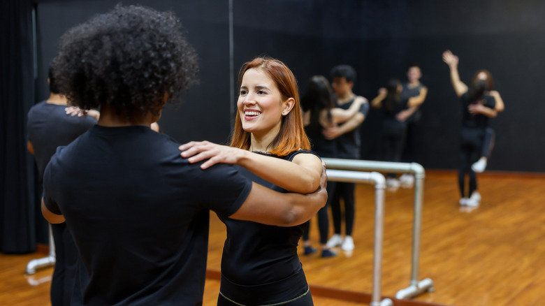 Couple takes dance lesson