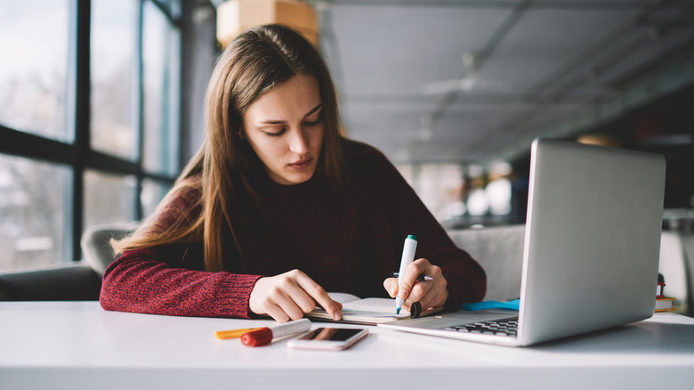 woman studying on laptop